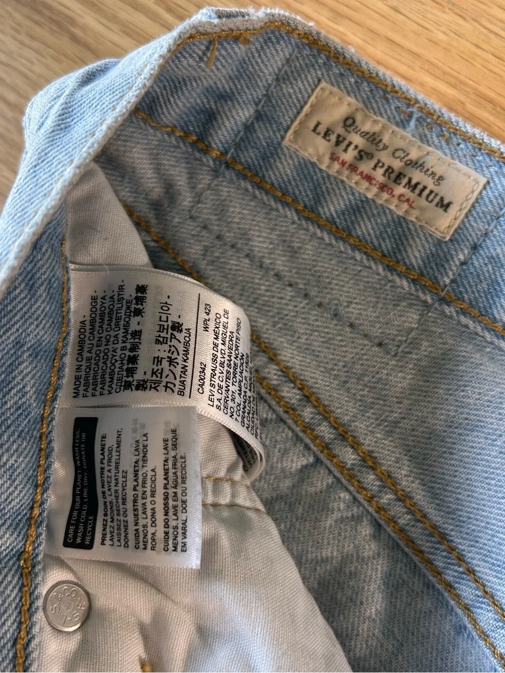 Levi's distressed light wash long denim button fly jean shorts size 28